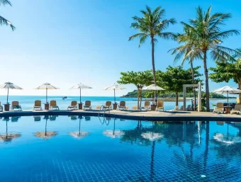 beautiful-tropical-beach-sea-with-umbrella-chair-around-swimming-pool_74190-10711 (1)